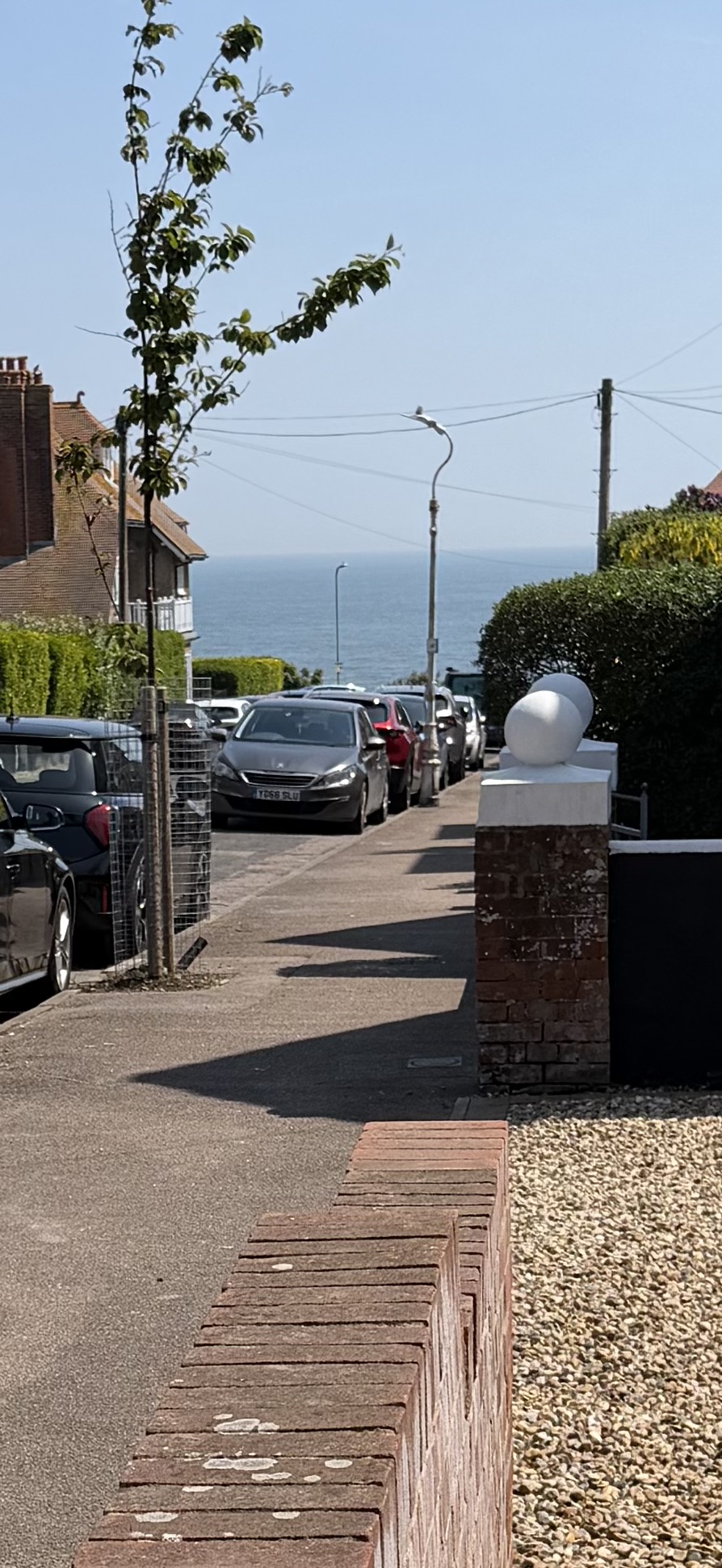 View down Dickens Road to the sea